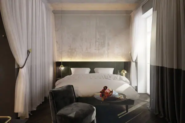 Camera da letto con un letto e un tavolo.